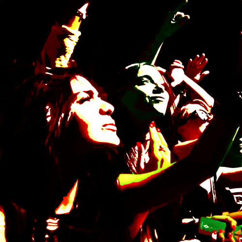 Techno festival goers in the crowd